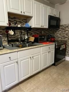 kitchen featuring white cabinetry, sink, backsplash, and electric stove