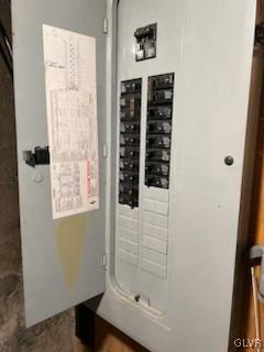 utility room featuring electric panel