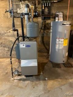 utility room featuring water heater