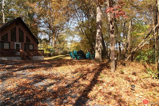 view of yard featuring a wooden deck