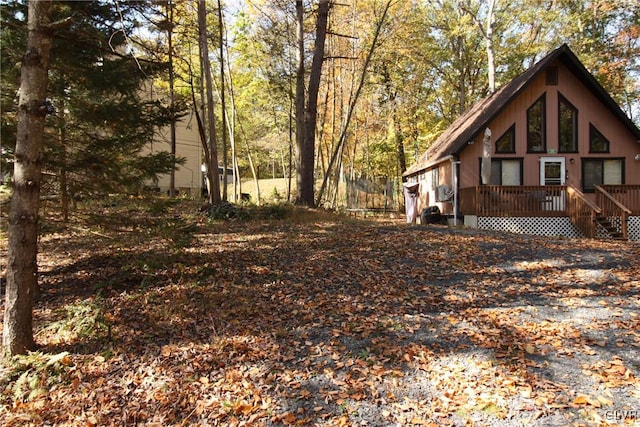 view of property exterior featuring a deck