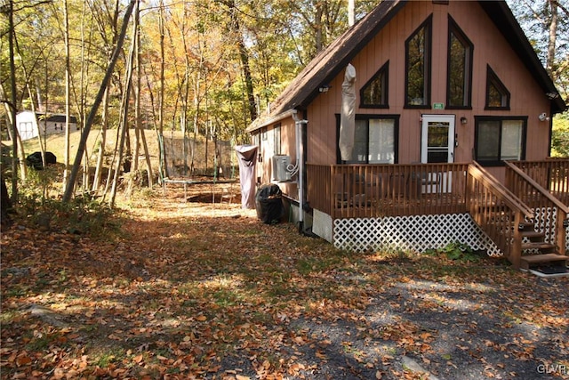 exterior space featuring a wooden deck