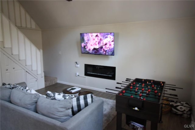 living room featuring hardwood / wood-style floors and vaulted ceiling