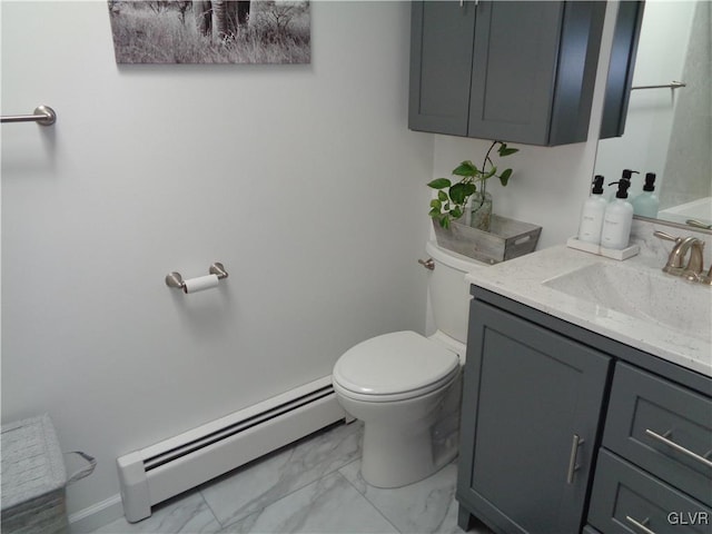 bathroom featuring vanity, toilet, and a baseboard heating unit