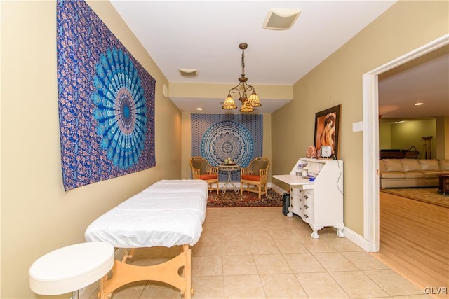 interior space featuring a notable chandelier and light tile patterned floors