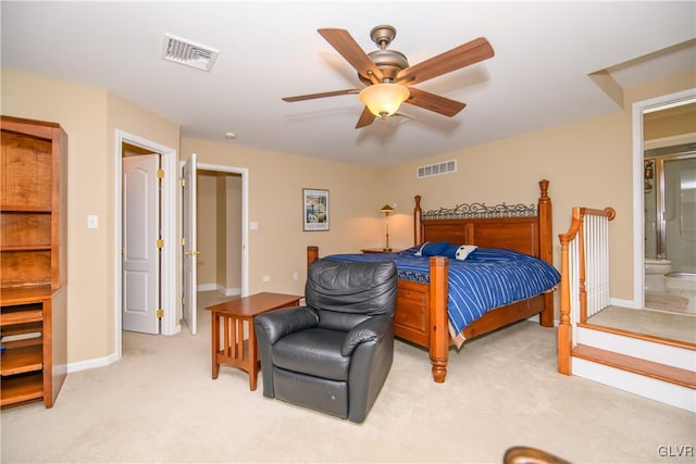 bedroom with connected bathroom, ceiling fan, and light colored carpet