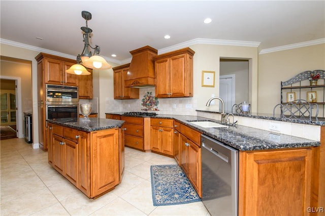 kitchen with kitchen peninsula, premium range hood, stainless steel appliances, sink, and decorative light fixtures