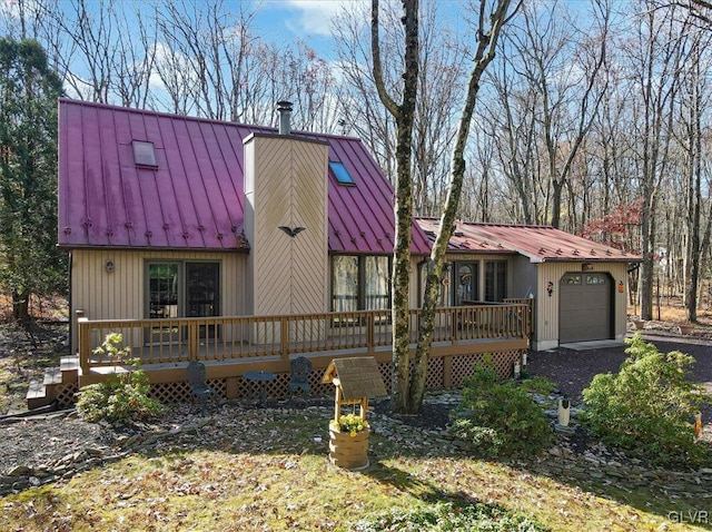 view of front of house featuring a wooden deck and a garage