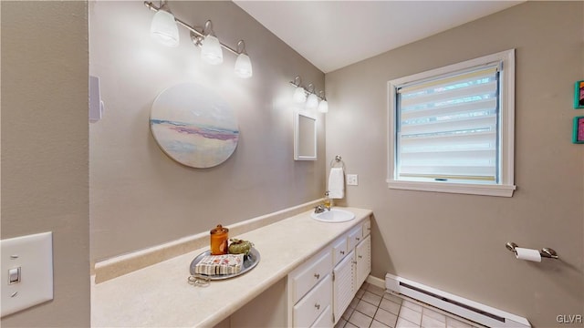 bathroom featuring baseboard heating, vanity, and tile patterned flooring