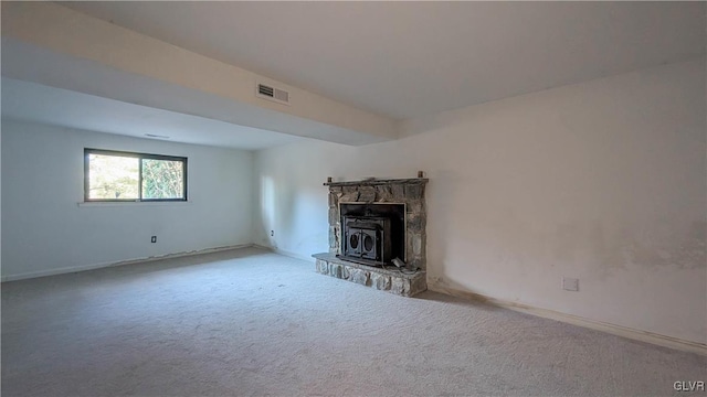 unfurnished living room featuring light colored carpet