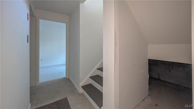 stairs with lofted ceiling