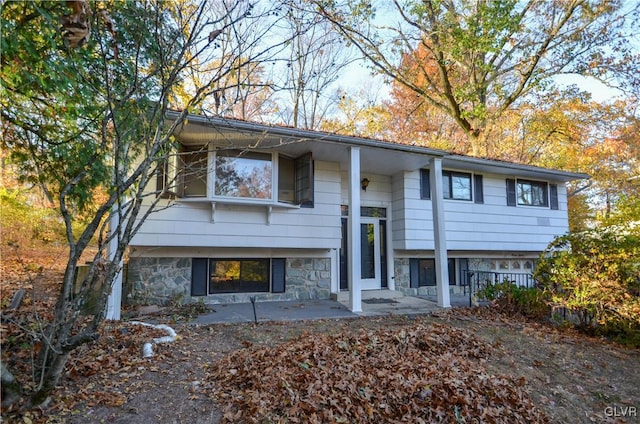 split foyer home featuring a patio area