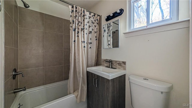 full bathroom with vanity, toilet, and shower / bath combo with shower curtain