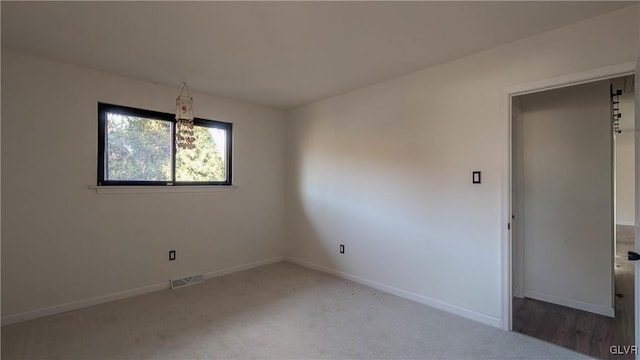 unfurnished room with carpet flooring