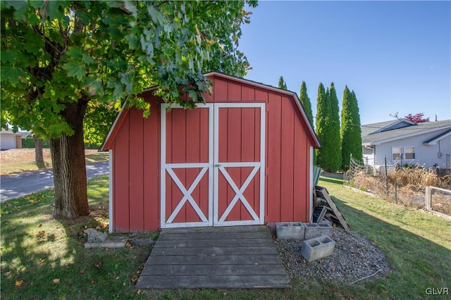 view of outdoor structure with a lawn