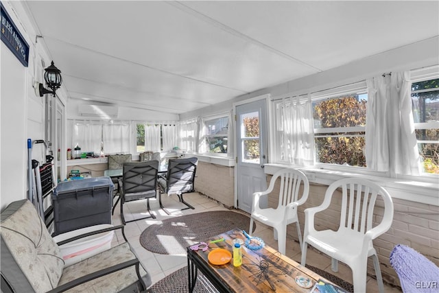 sunroom / solarium featuring a wall mounted air conditioner and vaulted ceiling