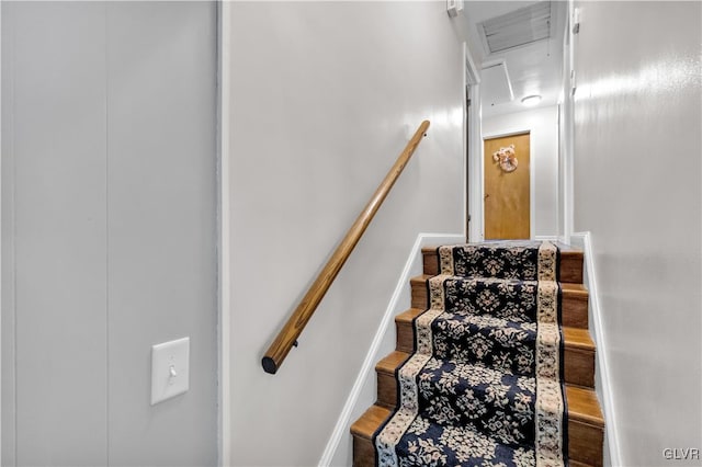 stairway with hardwood / wood-style flooring