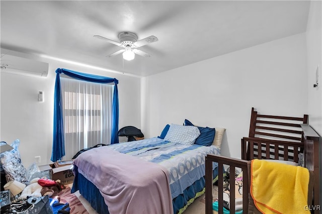 bedroom featuring ceiling fan and a wall unit AC