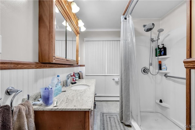 bathroom featuring vanity, a shower with curtain, and a baseboard radiator