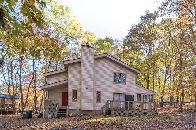 back of house with a wooden deck