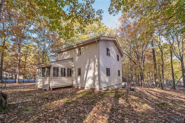 back of house with a sunroom