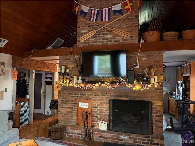 living room featuring a brick fireplace