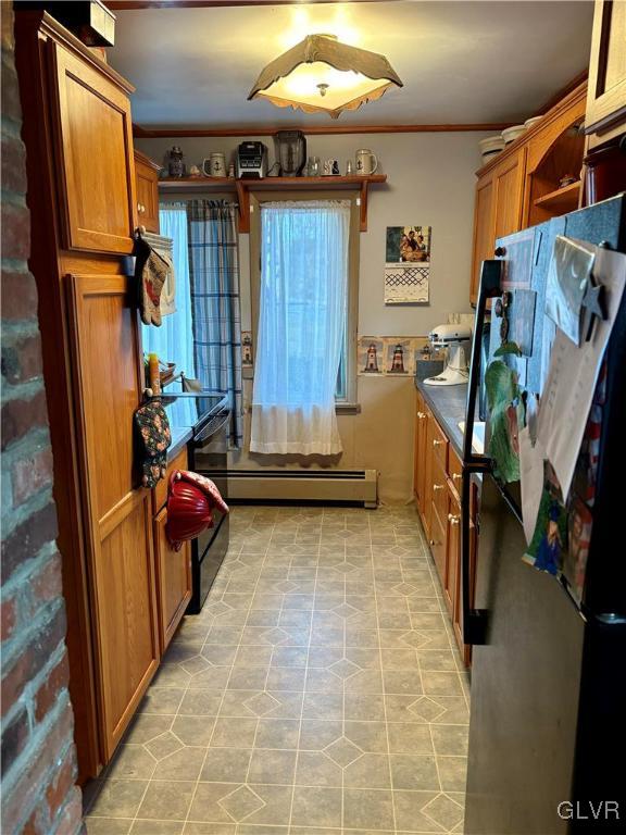 kitchen with stainless steel fridge, crown molding, and light tile patterned flooring