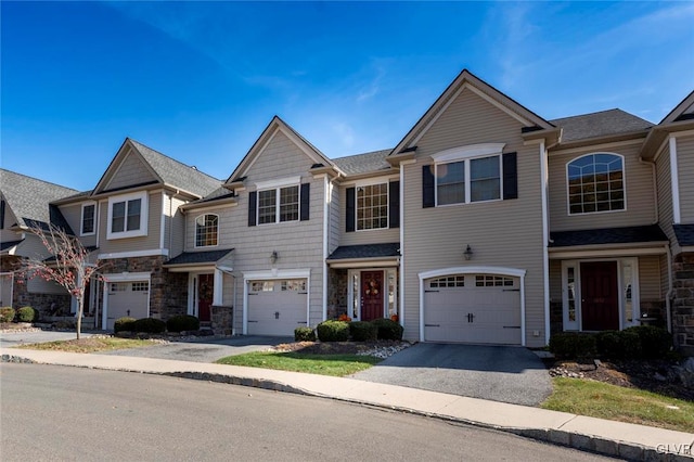 multi unit property featuring a garage