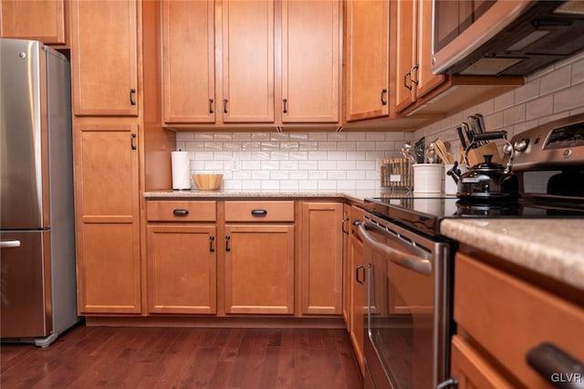 kitchen featuring decorative backsplash, dark hardwood / wood-style floors, and appliances with stainless steel finishes