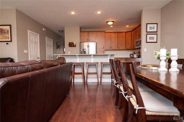 dining area featuring dark hardwood / wood-style flooring