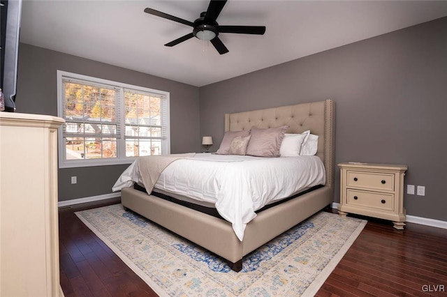 bedroom featuring ceiling fan and dark hardwood / wood-style floors