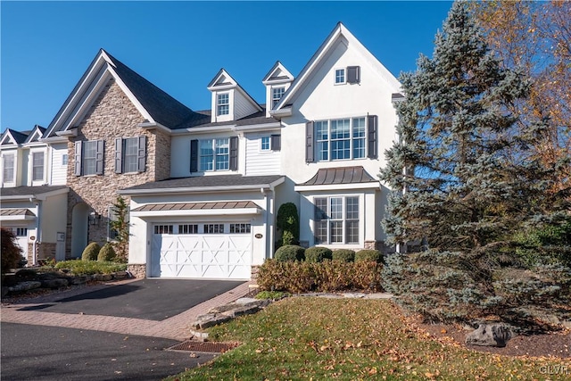 view of front of property with a garage