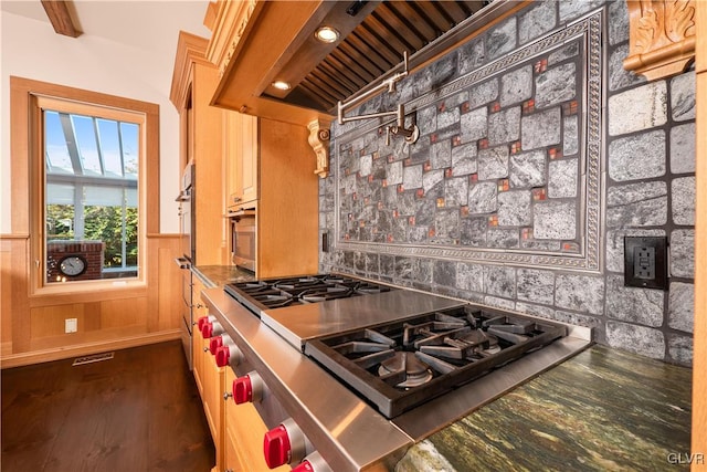 kitchen featuring beamed ceiling, dark wood-type flooring, custom range hood, and stainless steel gas stovetop