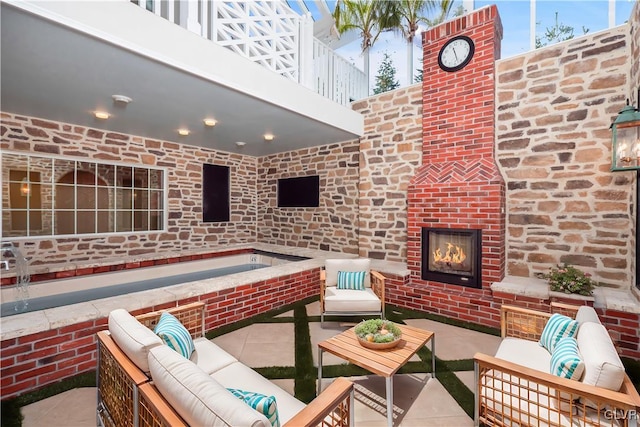 view of patio with a balcony and an outdoor hangout area