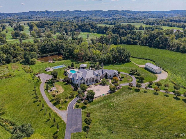 birds eye view of property with a rural view