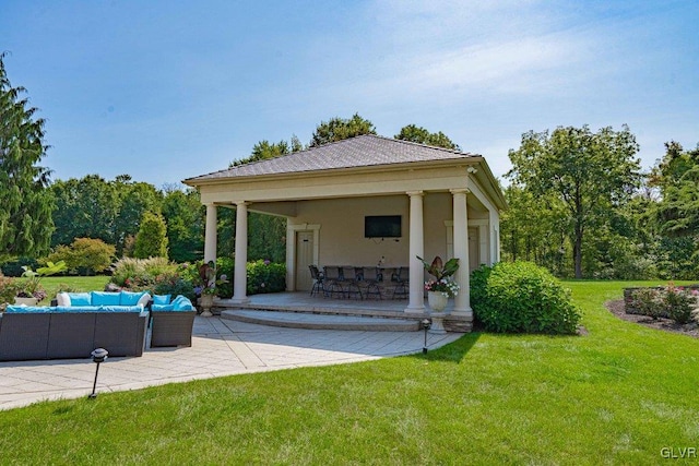 view of patio / terrace with a gazebo, a bar, and an outdoor hangout area