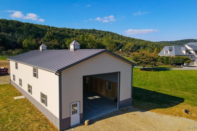 exterior space with a yard and a garage