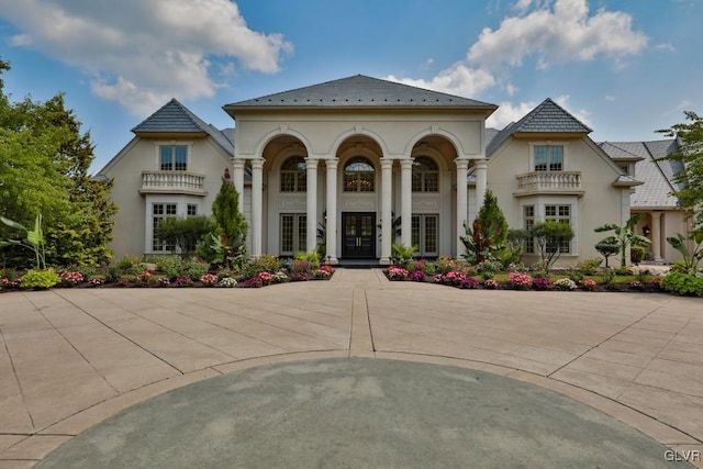 mediterranean / spanish-style house featuring french doors