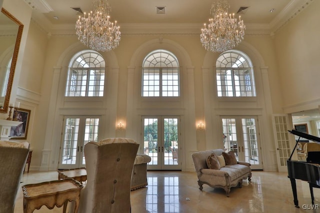 interior space with a wealth of natural light, a high ceiling, and french doors