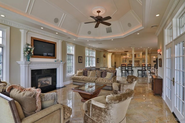 living room with crown molding, french doors, ceiling fan, and coffered ceiling