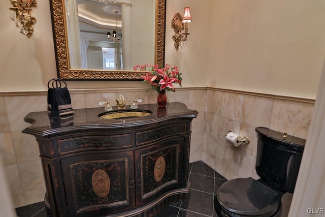 bathroom with tile patterned flooring, vanity, and toilet