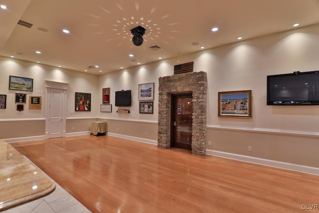 workout area featuring light hardwood / wood-style floors