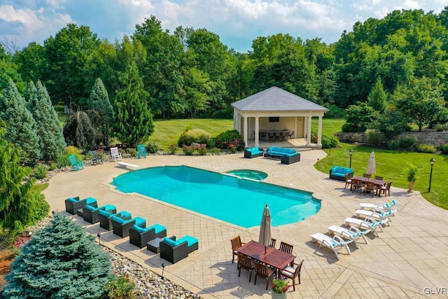 view of pool with an outdoor living space, a yard, and a patio