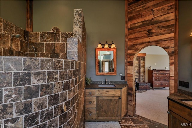 bathroom featuring vanity and walk in shower