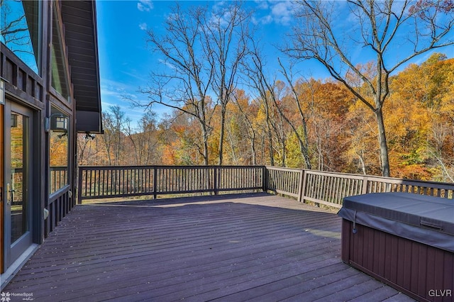 wooden terrace with a hot tub