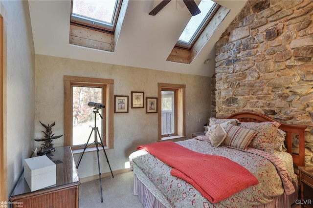 bedroom featuring light carpet, multiple windows, high vaulted ceiling, and ceiling fan