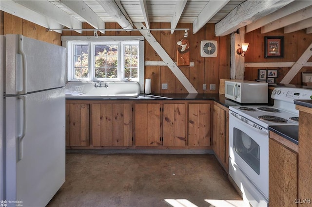 kitchen with wood walls, beam ceiling, sink, and white appliances