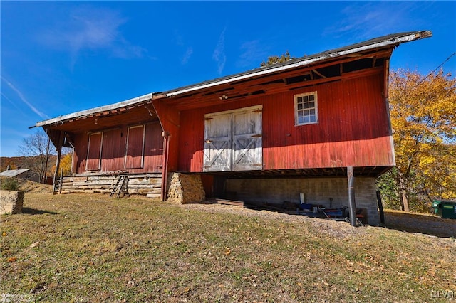 view of property exterior featuring a lawn