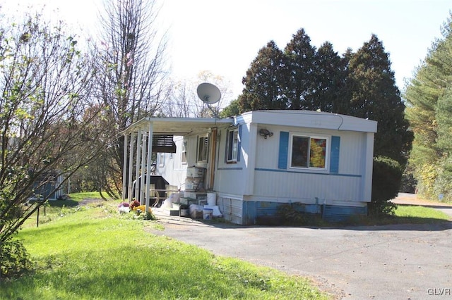 view of home's exterior with a yard