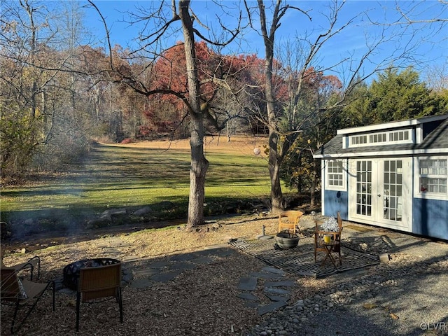 view of yard with french doors